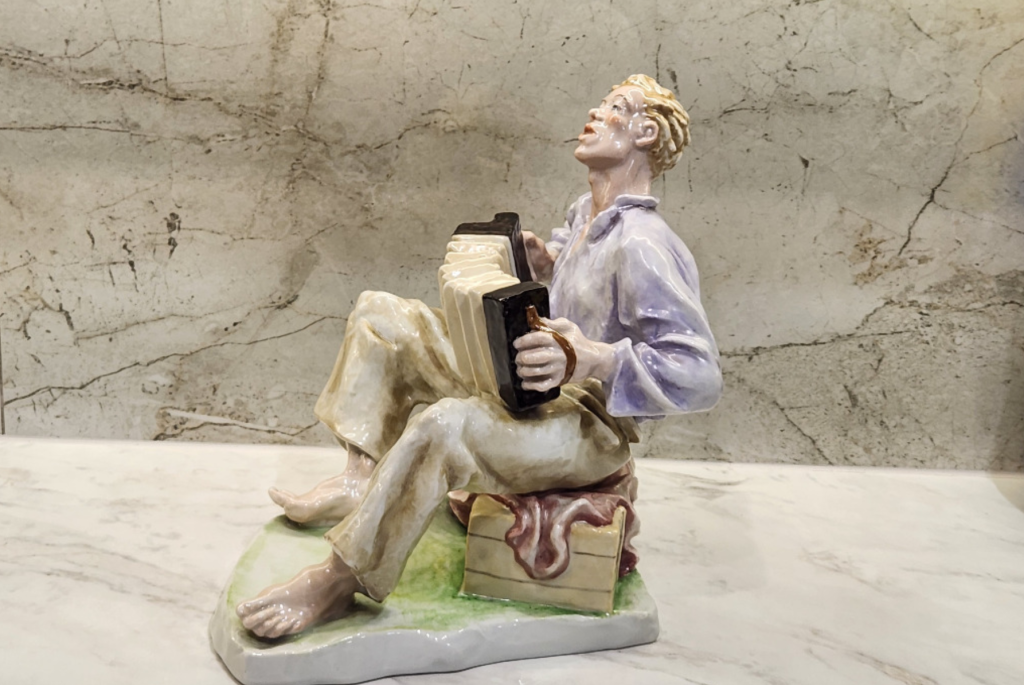 Decorative Figurine of a Boy, Handcrafted Ceramic Sculpture